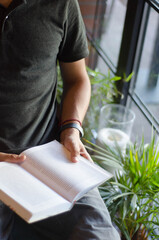 Man reading book in cozy place