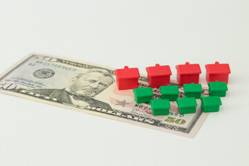 Naklejka premium Real estate and mortgage investment concept. Little houses on the white background.