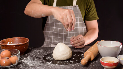 Obraz na płótnie Canvas A man is baking homemade bakery