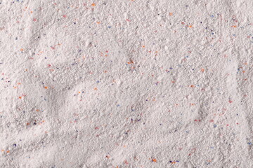 Washing powder with colorful granules, detergent background and texture