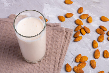 Organic almond milk above cotton towel, healthy