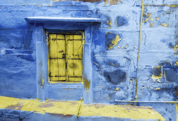 blue wall yellow door to the house, Jodhpur, India