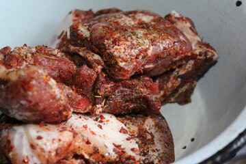 preparation of pork meat on the ribs with spices Provencal herbs for frying