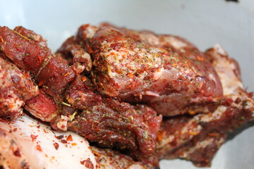 preparation of pork meat on the ribs with spices Provencal herbs for frying