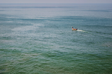 the sea to the horizon and a lone boat