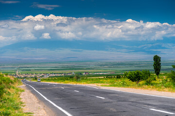 Highway in Armenia, view of the valley and Ararat behind the clouds