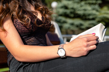 Girl with big breast sitting and reading a book