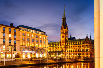 Fototapeta na wymiar View of Hamburg townhall Rathaus and small Alster lake during twilight sunset.
