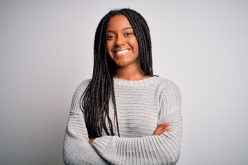 Young african american woman standing casual and cool over grey isolated background happy face smiling with crossed arms looking at the camera. Positive person. - Powered by Adobe