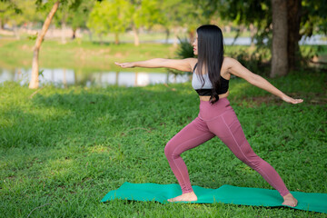Obraz na płótnie Canvas Beautiful asian fat woman play yoga at the park,Need to slim fit body