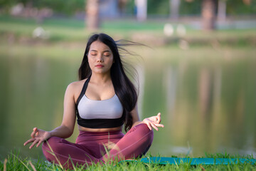 Beautiful asian fat woman play yoga at the park,Need to slim fit body