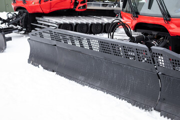 Plow on a snow grooming tractor