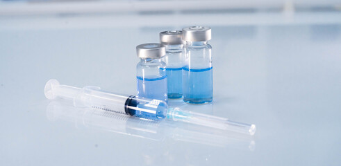 close up vaccine and syringe injection for prevention from  virus infection