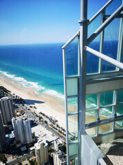 Naklejka premium Surfers Paradise is a suburb within the local government area of Gold Coast in Queensland, Australia - aerial view of the coastline with high rise hotels overlooking the beach.