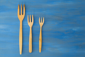 wooden spoon on the blue background.