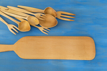 wooden spoon on the blue background.