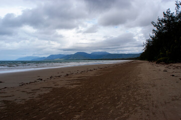Four mile beach at Port Douglas with heavy storm clouds on the sky