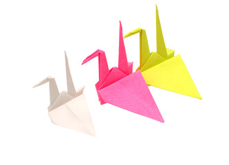 three colorful origami cranes flying, isolated whtie