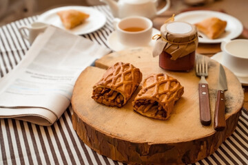 Baking with apple on wooden dish. Strudel - traditional Dutch dessert