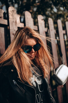 Portrait of a young girl. Photo session of a stylish girl outdoors.
