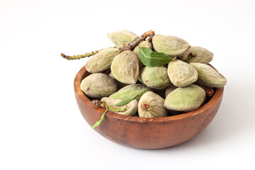 Fresh raw  almonds in the pod isolated on white background