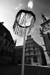 black and white shot of town square in Germany with maypole 