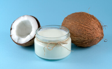 coconut oil and coconut on a blue background