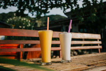 Beautiful colorful fruit juice on the beach