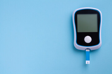 Glucometer for diagnosis Diabetes close-up. Monitoring sugar or insulin in blood level with copy space