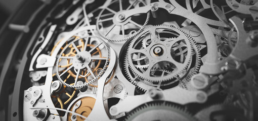 Fototapeta Gears and cogs in clockwork watch mechanism. Craft and precision obraz