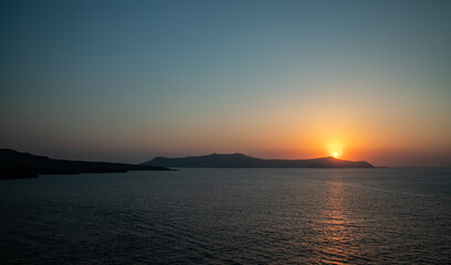 Naklejka na ściany i meble Santorini sunset from Fira, capital of the Greek Aegean island, Greece