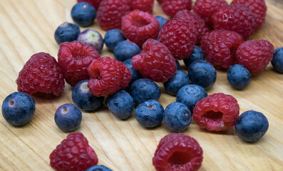 Ripe juicy blueberries and raspberries in close-up