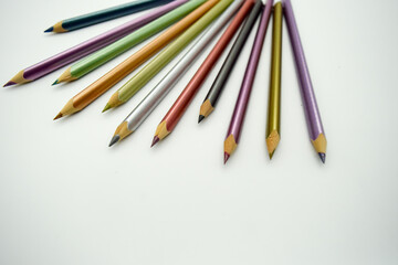 Colored pencils on a white background