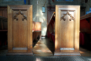 Close up of empty pews in a parish church in the UK