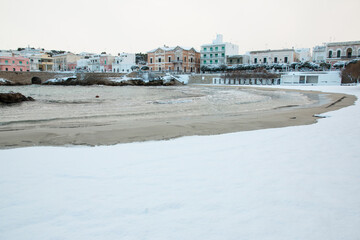 Santa Maria al Bagno beach after a exceptional snowfall, Salento, Italy
