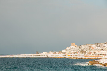 Ionian coast after a exceptional snowfall, Salento, Italy