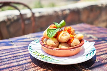 Delicious plate with potatoes and sauce