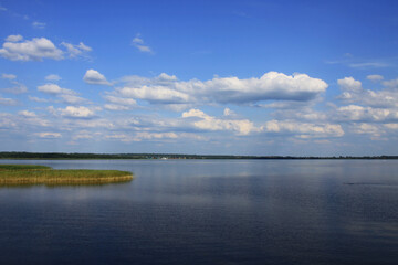 Fototapeta na wymiar White clouds above lake Seliger