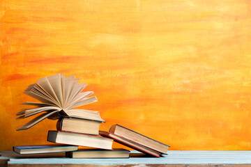 Books on wooden desk table and abstract background. Education background. Copy Space. Back to school.