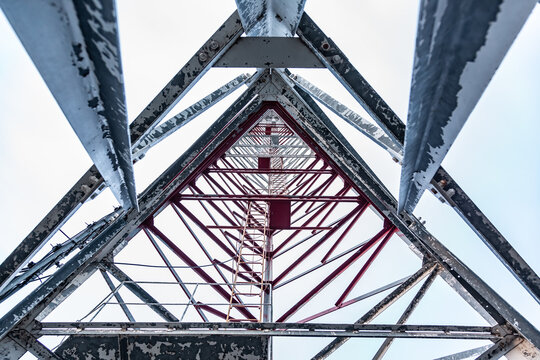 Metal Mobile Communications Tower Cell Site Close-up. Inside View, Bottom View. Horizontal Orientation. 