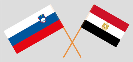 Crossed flags of Egypt and Slovenia. Official colors