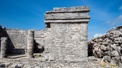 Side view of old stone ruins situated in the ancient Mayan city of Tulum in Quintana Roo, Mexico.