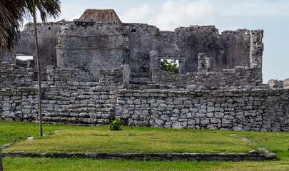 Side view of stone walls and ruins situated in the ancient Mayan city of Tulum in Quintana Roo, Mexico.