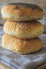 Homemade burger bread with poppy seeds and sesame