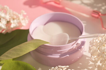 Hydrogel eye patches in a jar. Fashionable beautiful face lifting tool.