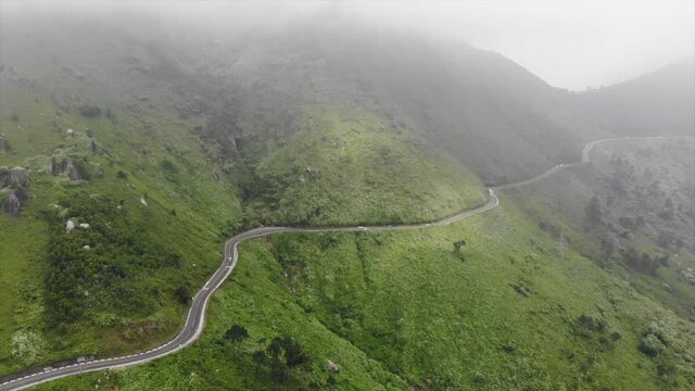 A long and curvey road along the mountains heading to Hue in Vietnam