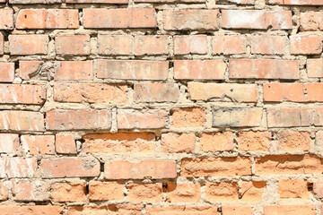 Old weathered brick wall fragment.