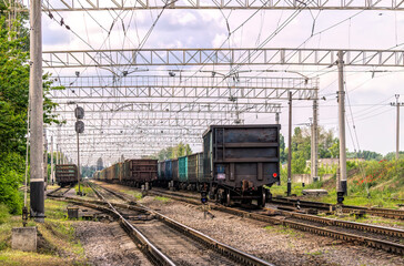 Fototapeta na wymiar Railway interchange and old wagons for cargo transportation