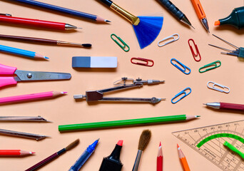 Flat composition of School stationery on a colorful background. Background of school stationery. The view from the top.