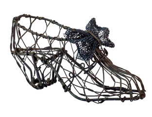 Vintage ladies ornamental wireframe shoe with high heel and bow. Isolated.